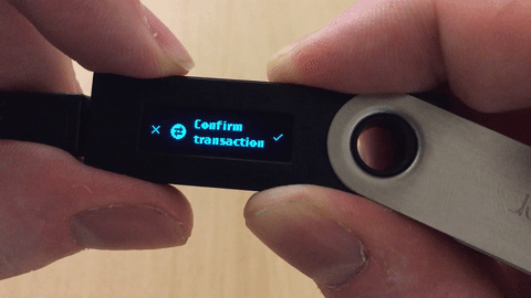Confirming a transaction requires pressing a physical button